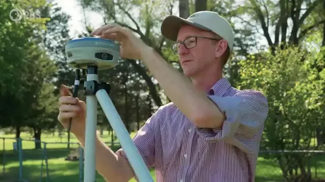 Researcher using GPS equipment
